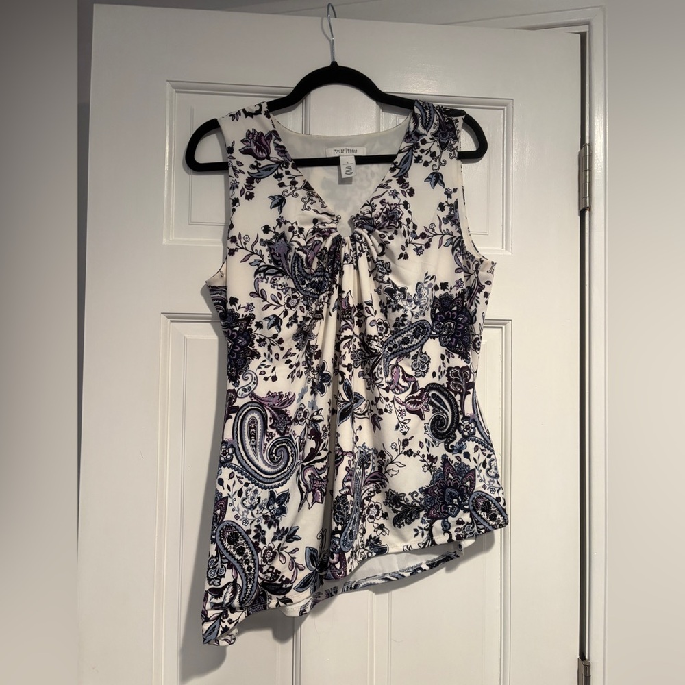 Blue, white and a touch of purple Polyester with spandex lining 
Sleeveless top